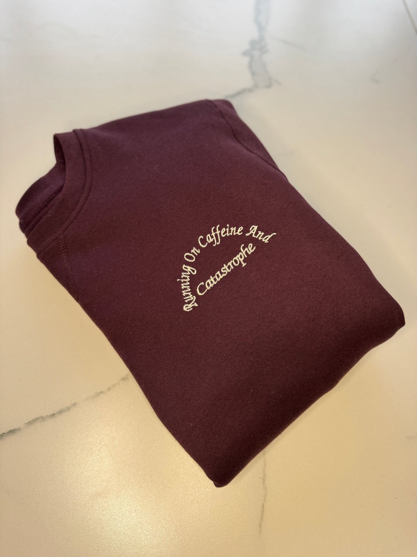 Running On Caffeine And Catastrophe Sweatshirt