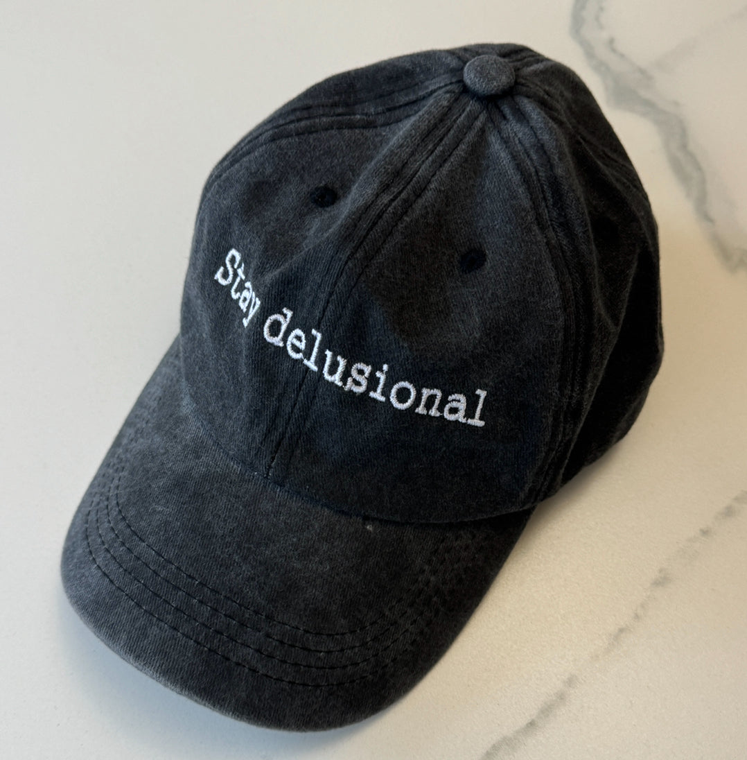 Stay delusional cap
